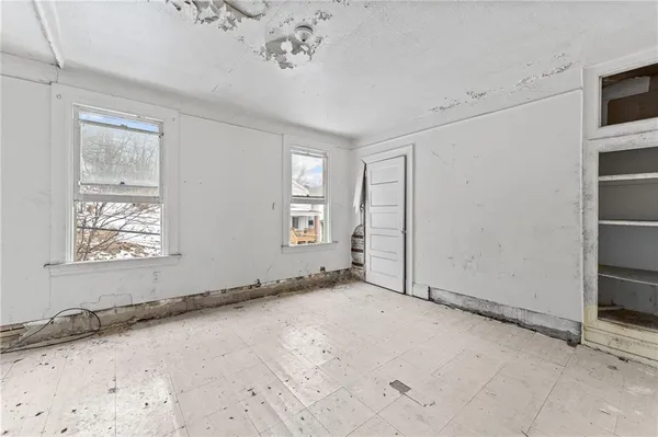 an empty room with windows