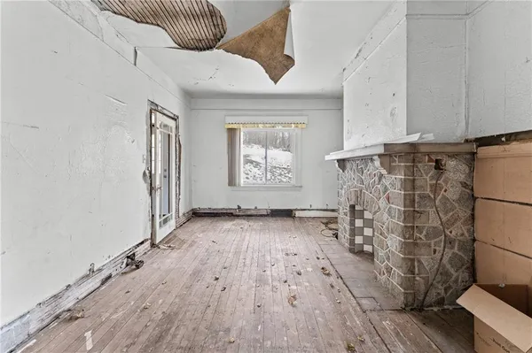 a view of entryway with wooden floor