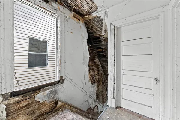 a view of wooden door and stairs