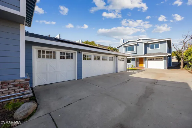 a view of empty room with a fireplace and wooden floor