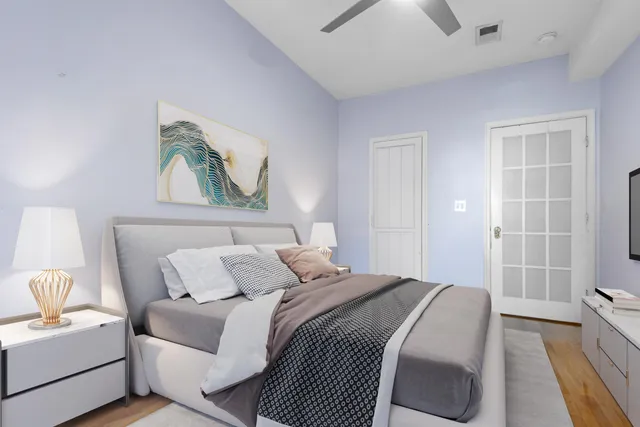 a bedroom with a bed and a couch