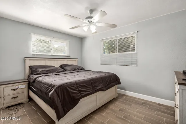 a bedroom with a large bed and a window