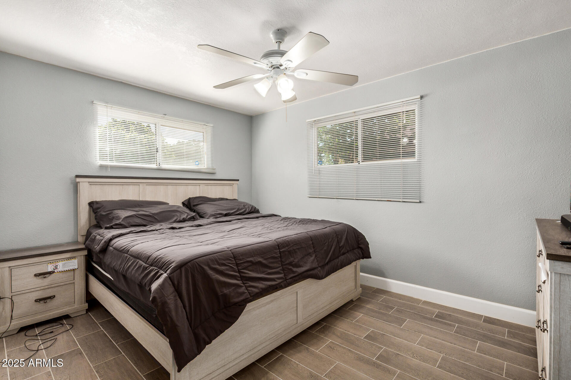 2726 West Ruth Avenue Phoenix, AZ 85051 - Photo 16 of 28 a bedroom with a large bed and a window