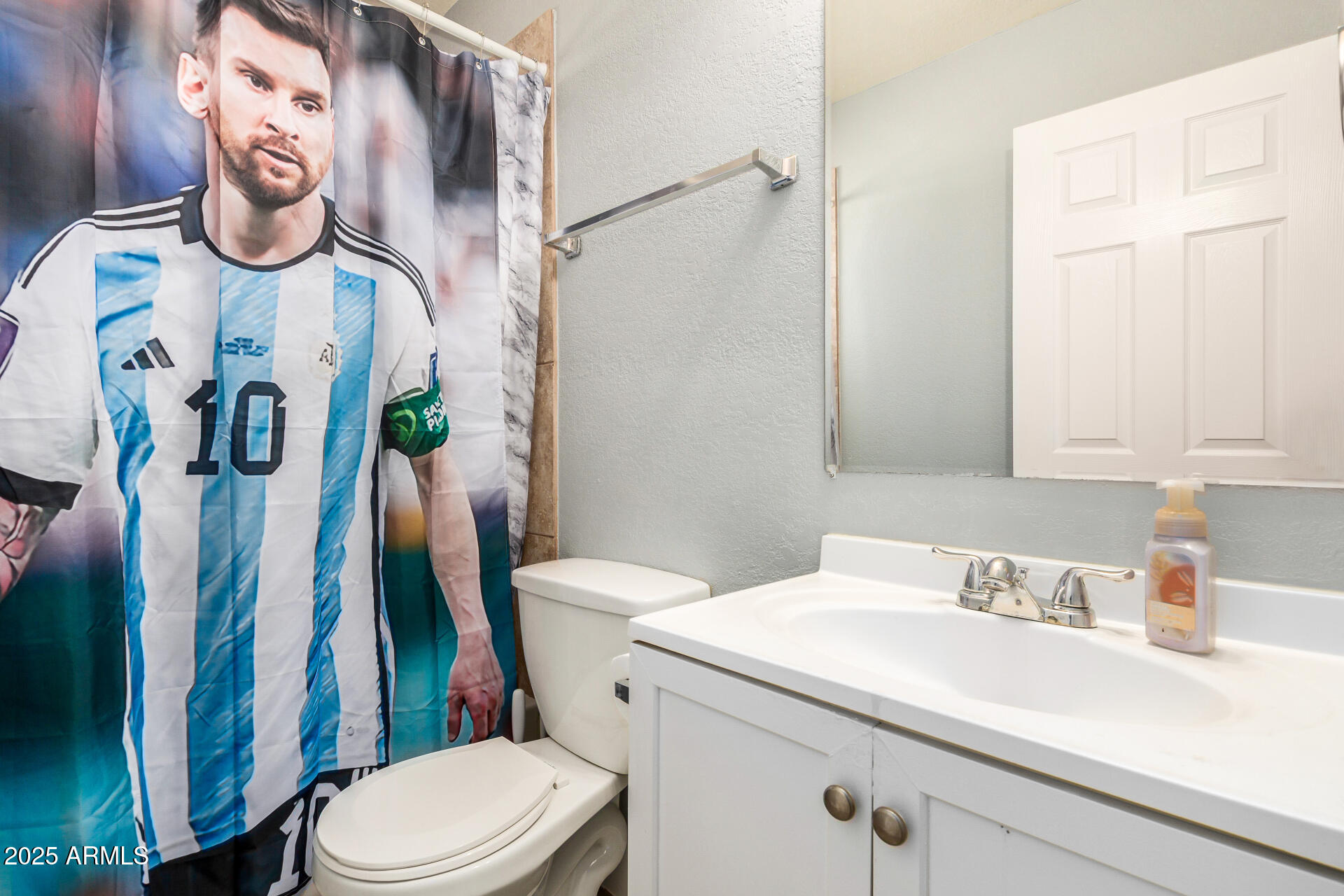 2726 West Ruth Avenue Phoenix, AZ 85051 - Photo 18 of 28 a bathroom with a sink and a toilet