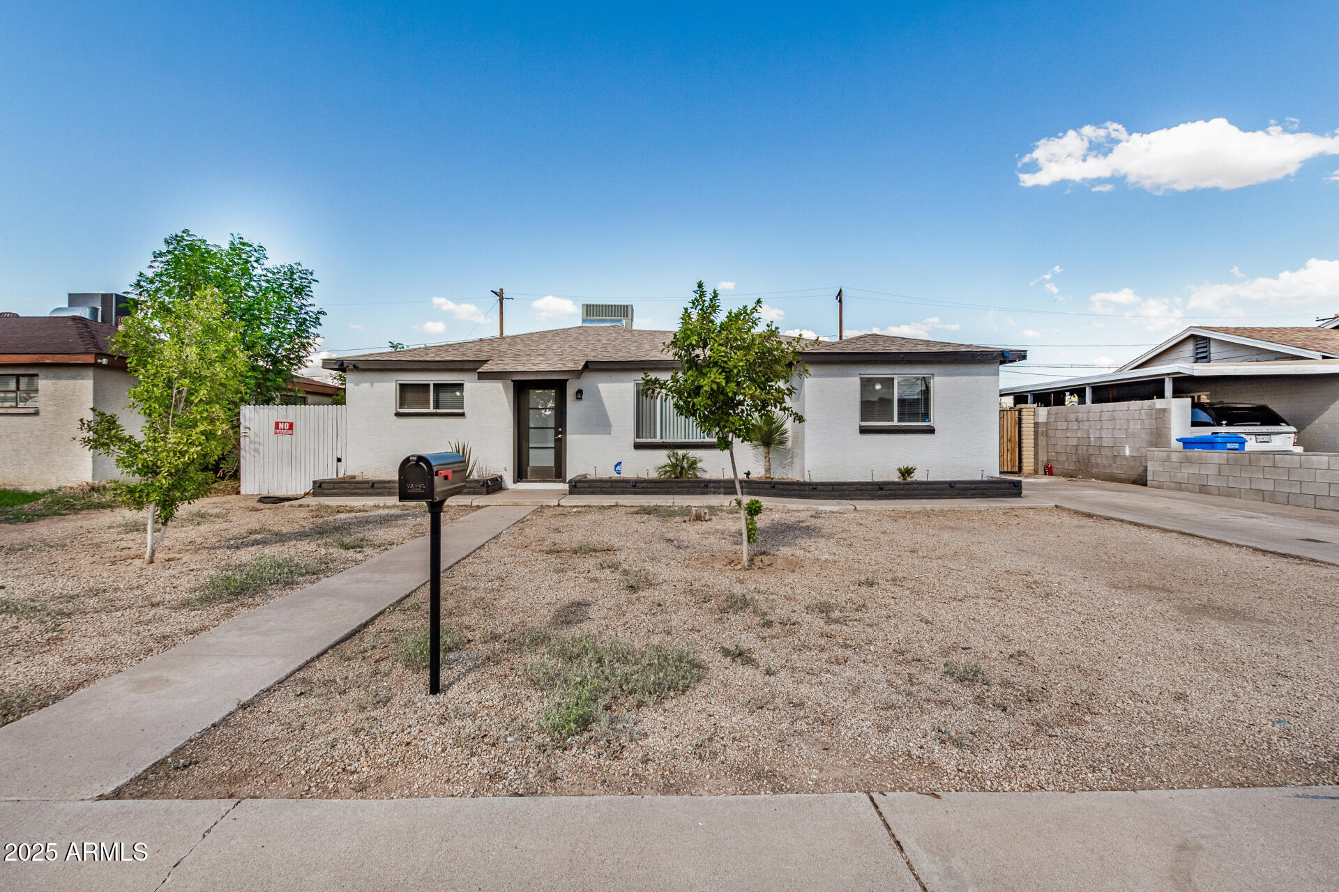 2726 West Ruth Avenue Phoenix, AZ 85051 - Photo 2 of 28 a front view of a house with a yard
