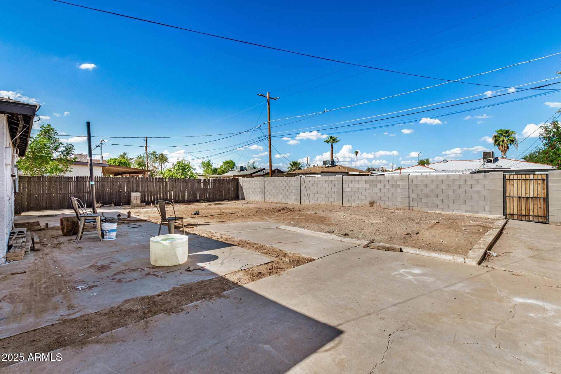 2726 West Ruth Avenue Phoenix, AZ 85051 - Photo 26 of 28 a view of a patio with a table and chairs and potted plants