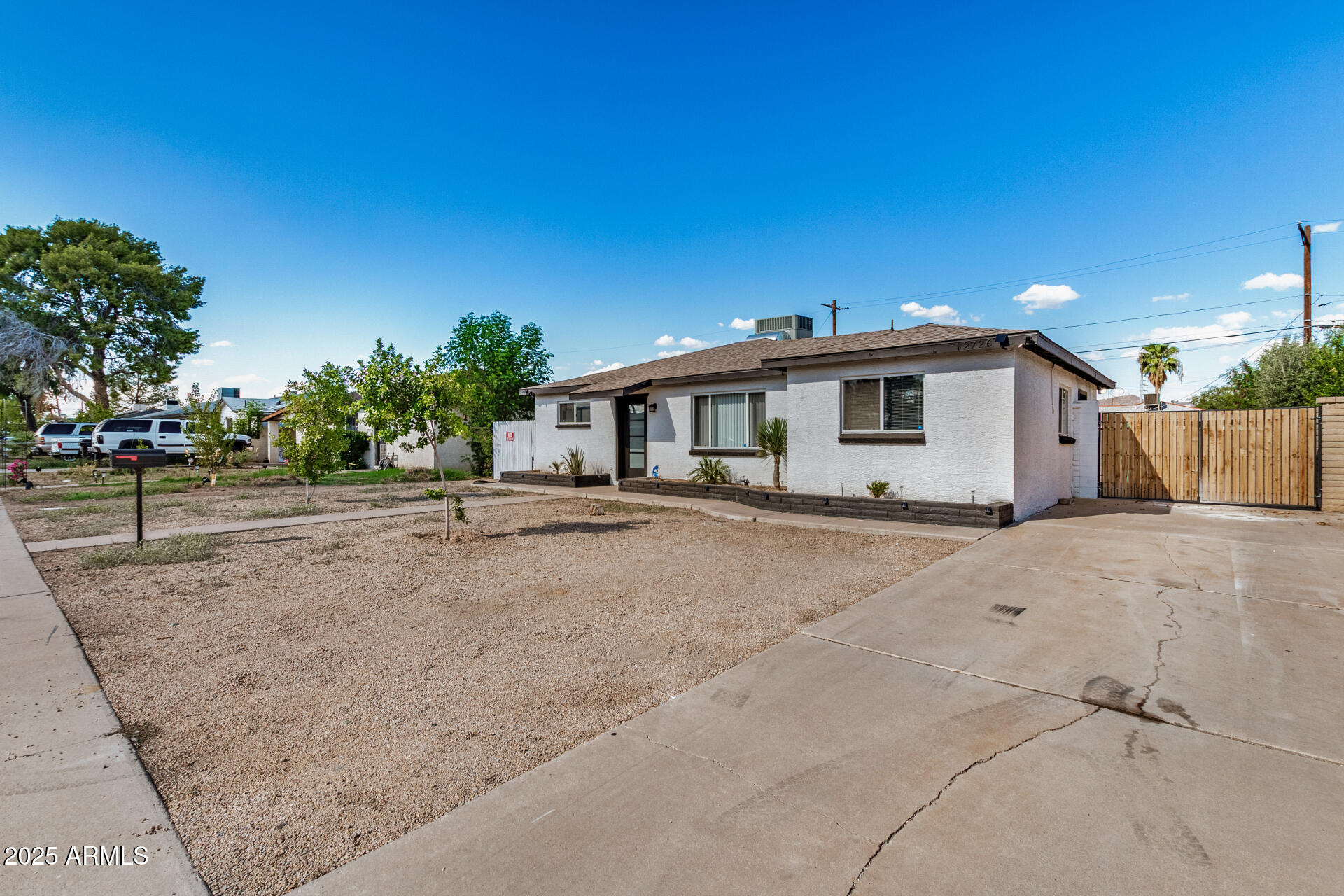 2726 West Ruth Avenue Phoenix, AZ 85051 - Photo 5 of 28 a view of a house with backyard and trees