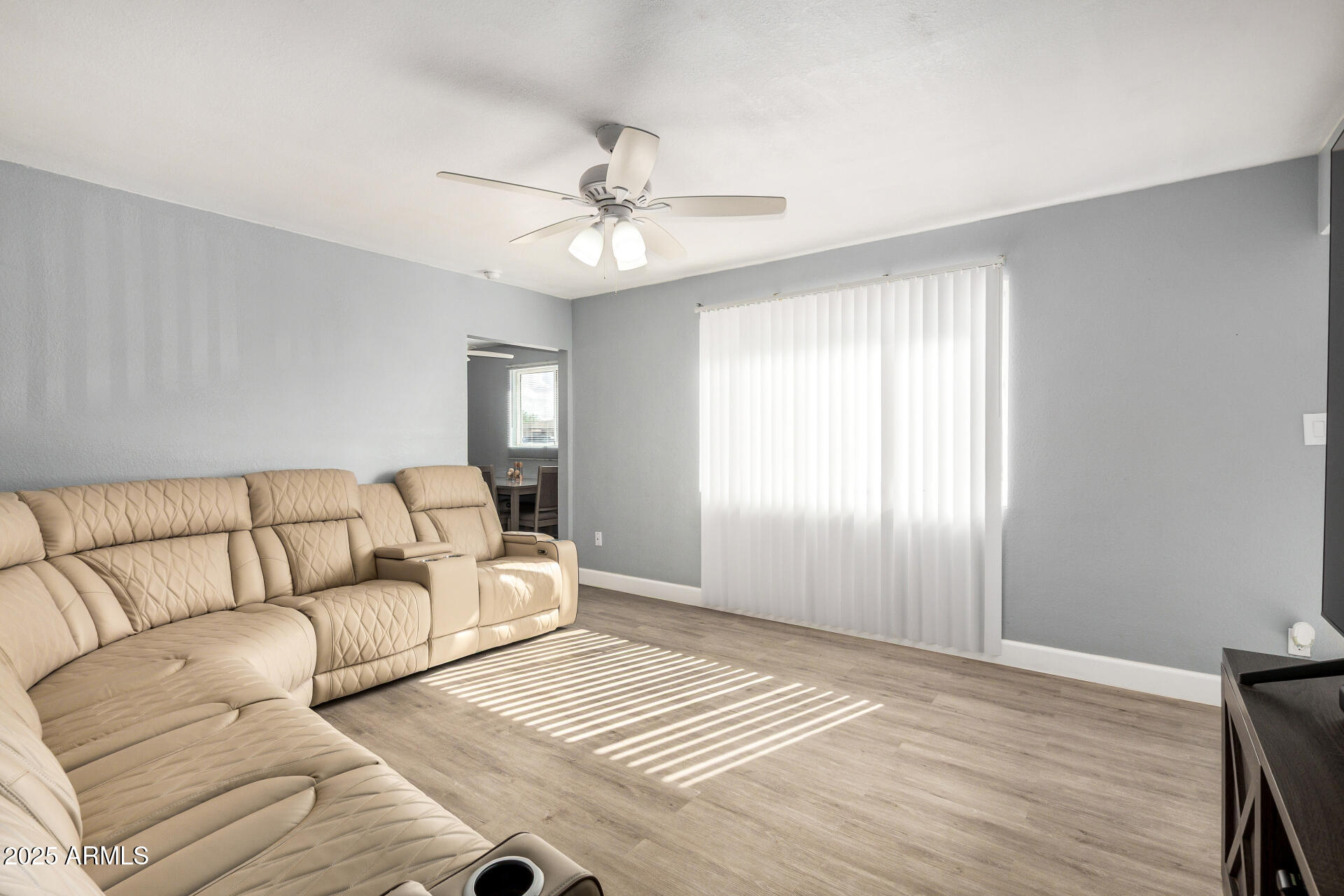 2726 West Ruth Avenue Phoenix, AZ 85051 - Photo 9 of 28 a living room with furniture and a window