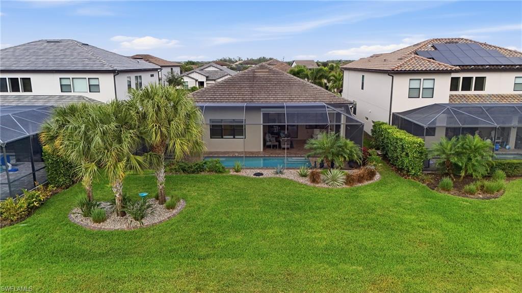 17210 Ashcomb Way Estero, FL 33928 - Photo 40 of 47 a front view of a house with a yard