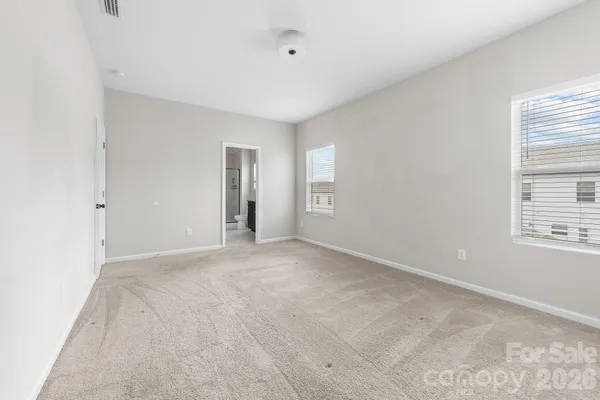 a view of a patio with a table and chairs