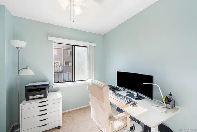 a view of a workspace with furniture