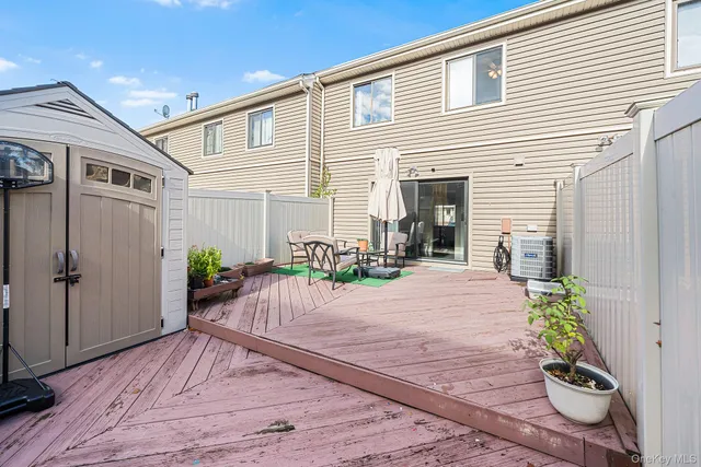 a very nice looking house with potted plants in front of it