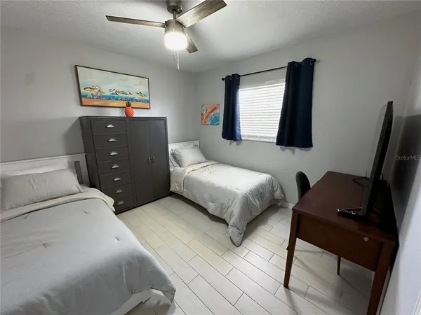 a bedroom with a bed and furniture