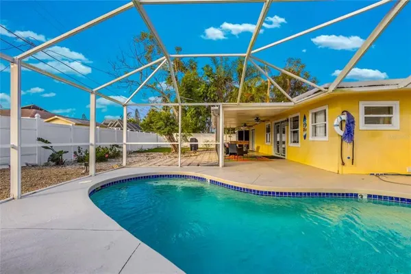 a view of a swimming pool with a patio
