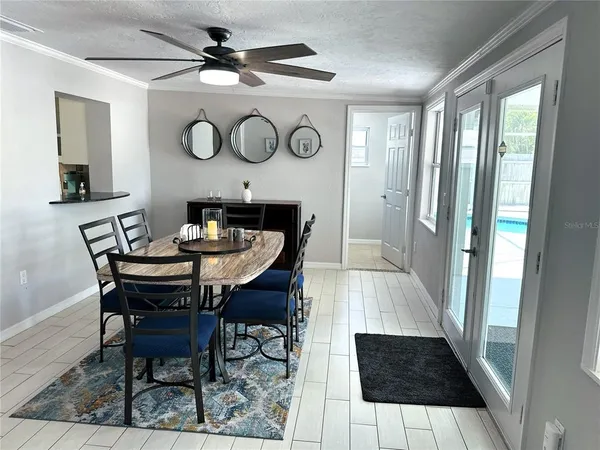 a view of a dining room with furniture and a rug
