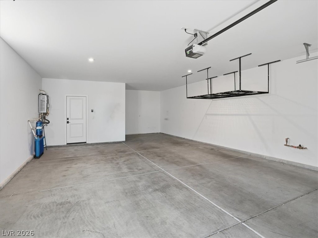 9725 Starlight Ridge Avenue Las Vegas, NV 89148 - Photo 38 of 47 This spacious garage offers ample room and functional overhead storage.