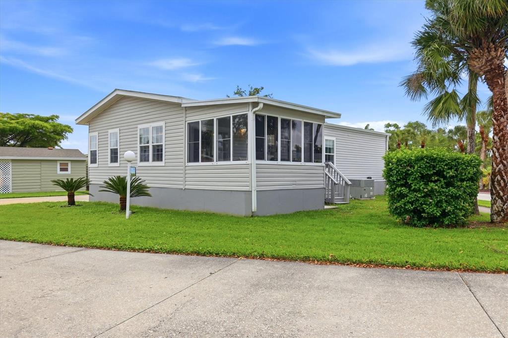 1 Meadow Circle Ellenton, FL 34222 - Photo 2 of 43 a front view of a house with a garden