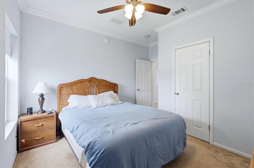 1 Meadow Circle Ellenton, FL 34222 - Photo 23 of 43 a bedroom with a bed and a chandelier