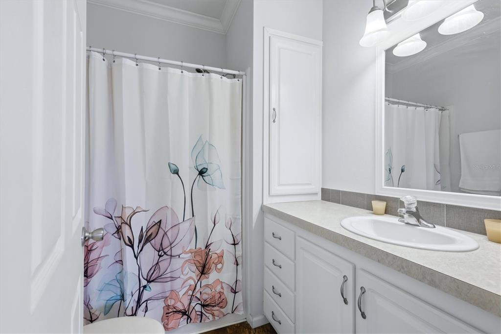 1 Meadow Circle Ellenton, FL 34222 - Photo 24 of 43 a bathroom with a granite countertop sink and a mirror