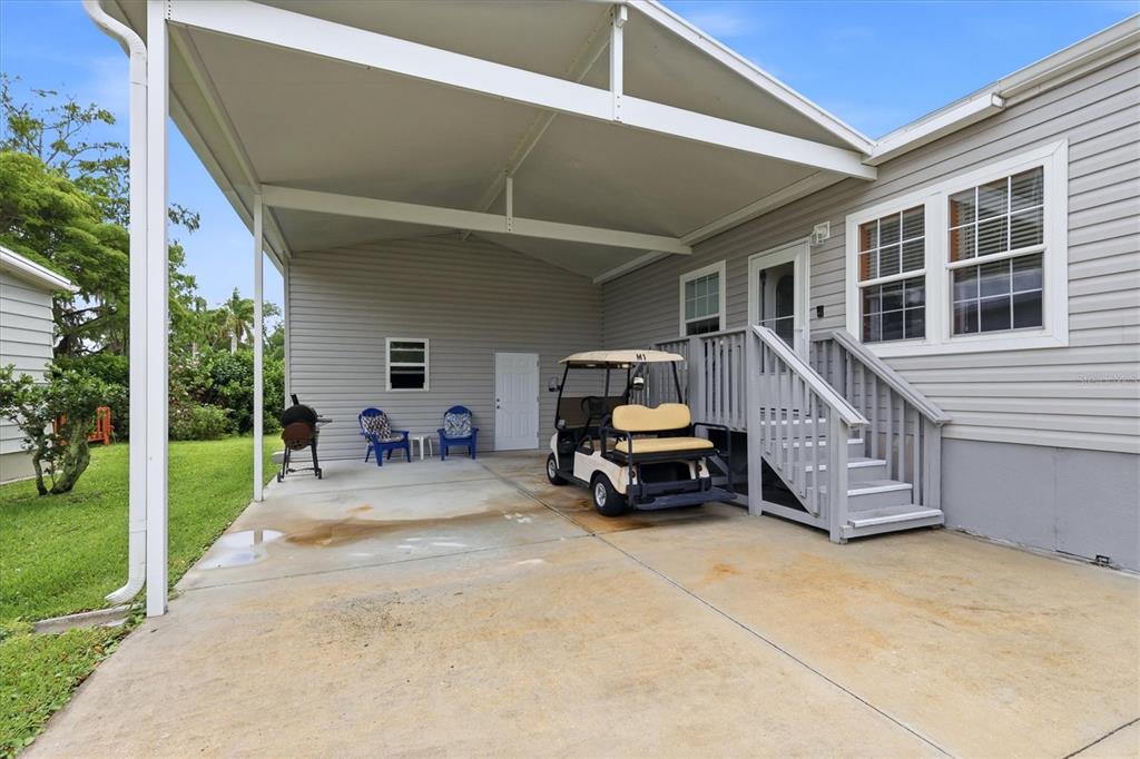 1 Meadow Circle Ellenton, FL 34222 - Photo 3 of 43 a view of a house with a barbeque and wooden stairs