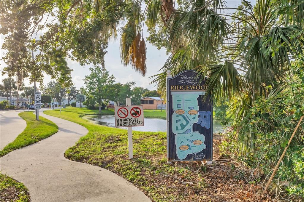 1 Meadow Circle Ellenton, FL 34222 - Photo 33 of 43 a sign board with a yard and trees
