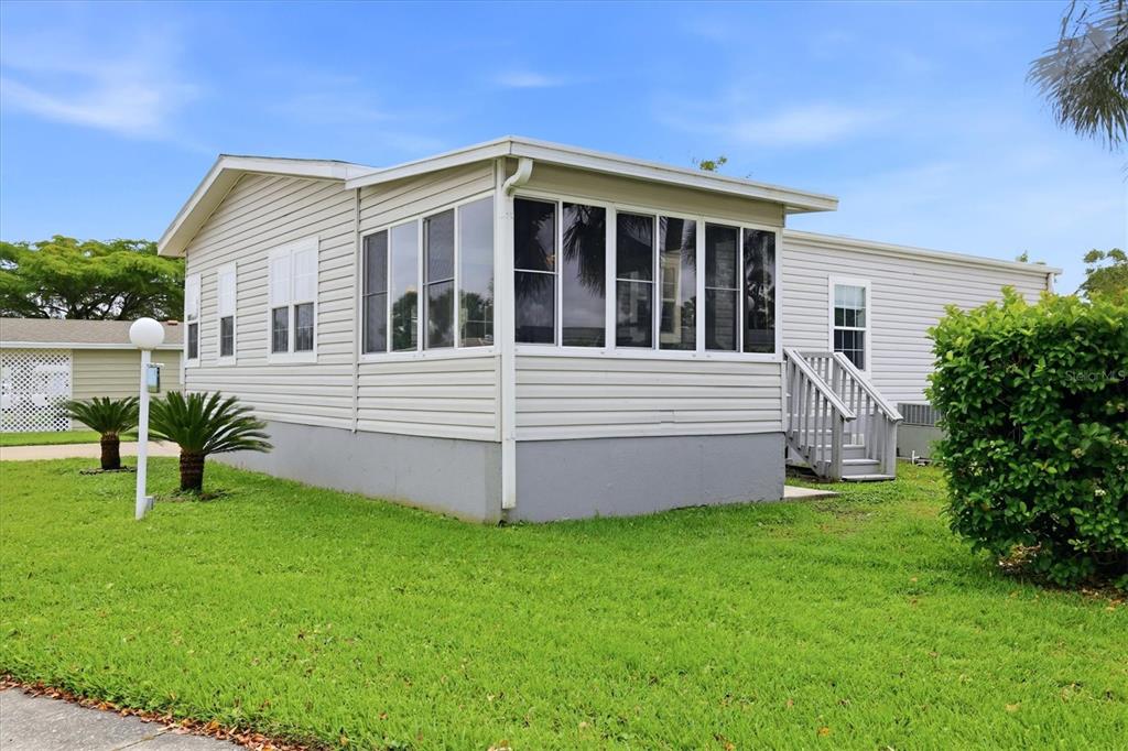 1 Meadow Circle Ellenton, FL 34222 - Photo 43 of 43 a front view of a house with a yard and garage