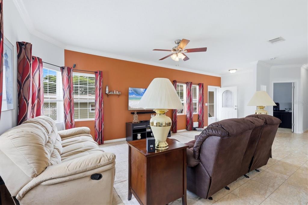 1 Meadow Circle Ellenton, FL 34222 - Photo 8 of 43 a living room with furniture a couch and a chandelier