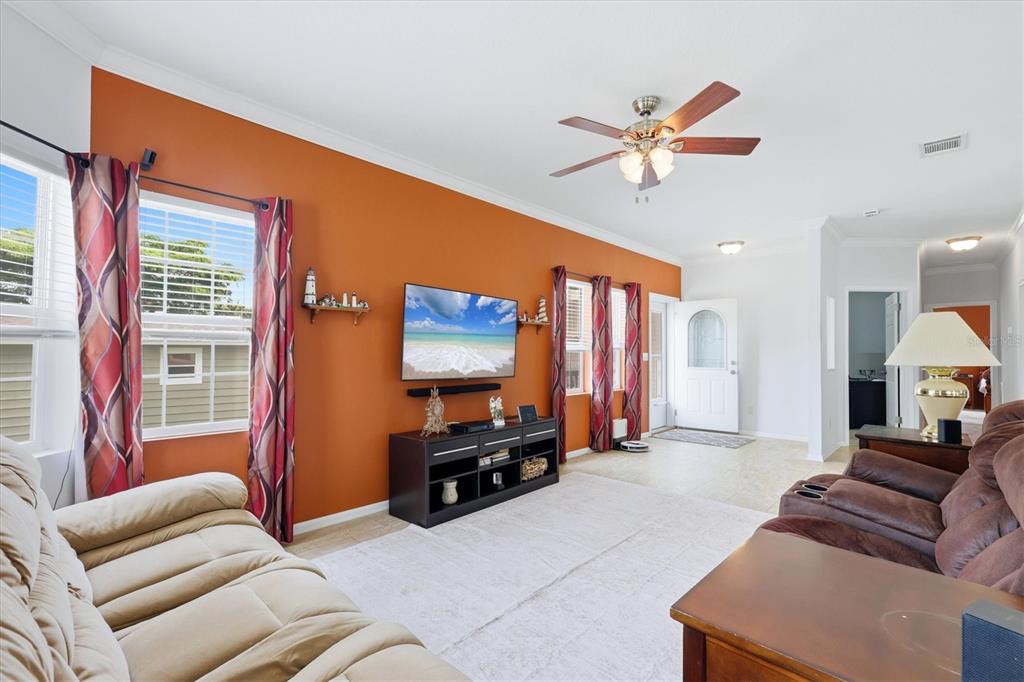 1 Meadow Circle Ellenton, FL 34222 - Photo 9 of 43 a living room with furniture ceiling fan and a window