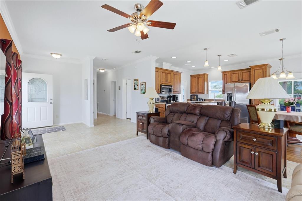 1 Meadow Circle Ellenton, FL 34222 - Photo 10 of 43 a living room with furniture a ceiling fan and a rug