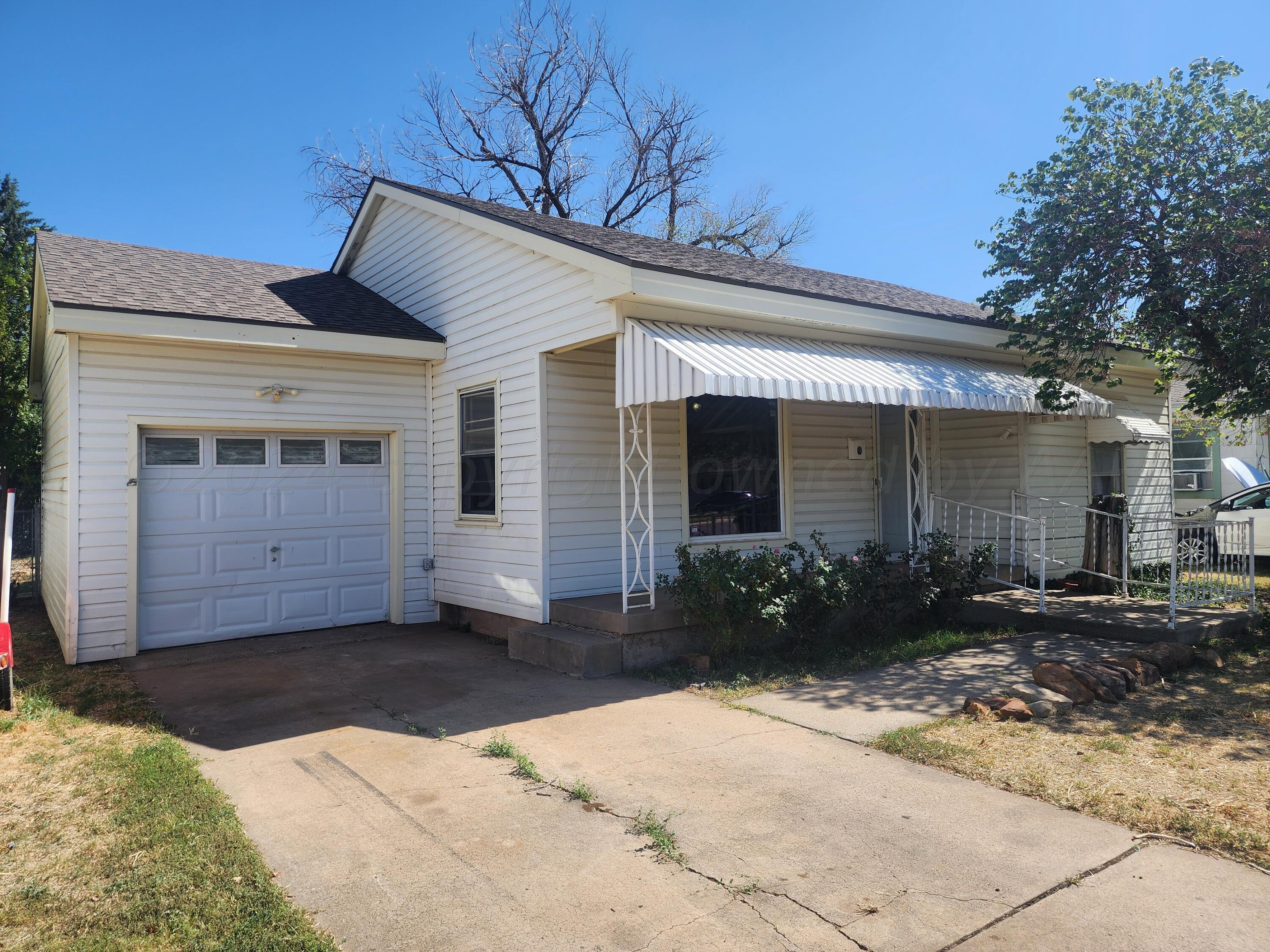 4003 Cline Road Amarillo, TX 79110 - Photo 17 of 17 a front view of a house with a yard