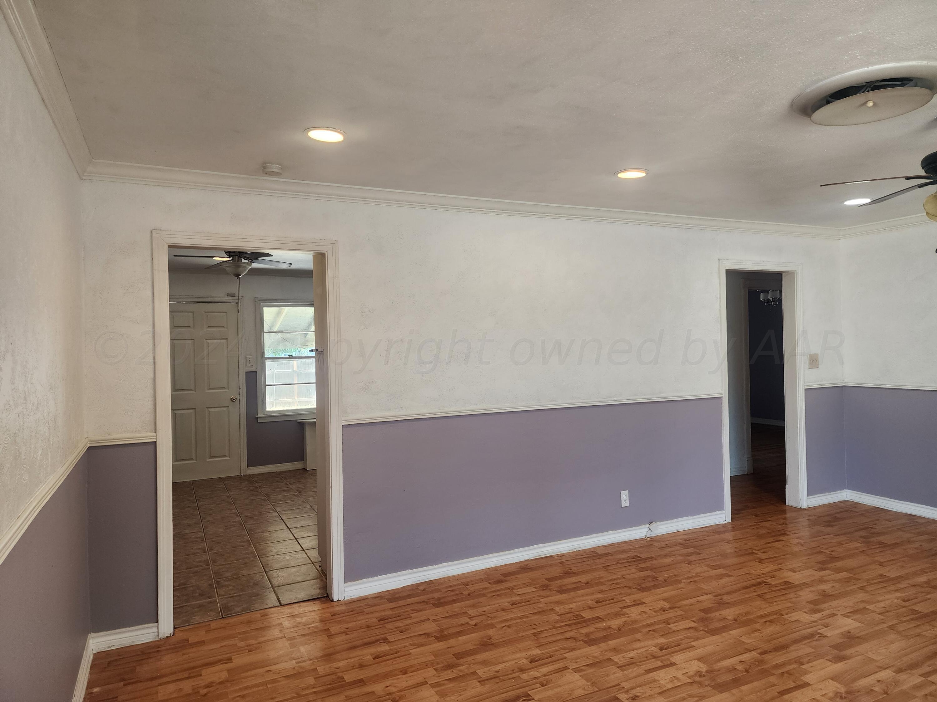 4003 Cline Road Amarillo, TX 79110 - Photo 2 of 17 a view of an empty room and window