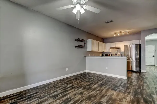 a view of a kitchen with a sink and cabinets