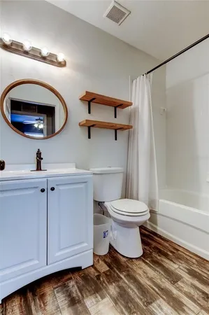 a bathroom with a toilet and a sink