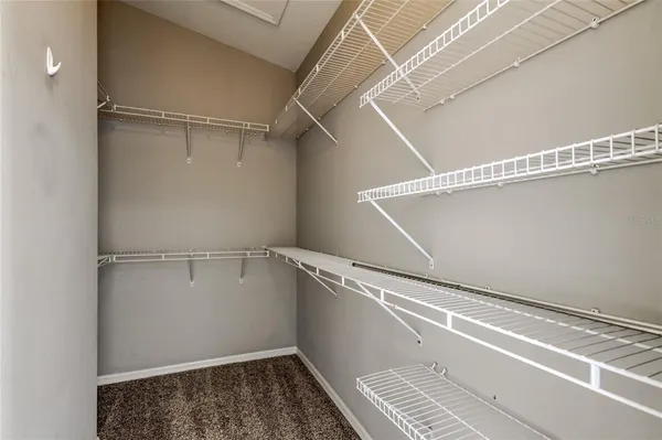 a view of a room with racks on the wall