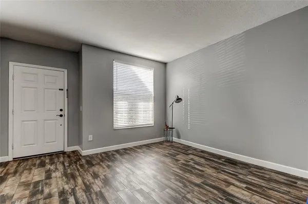 a view of an empty room and window