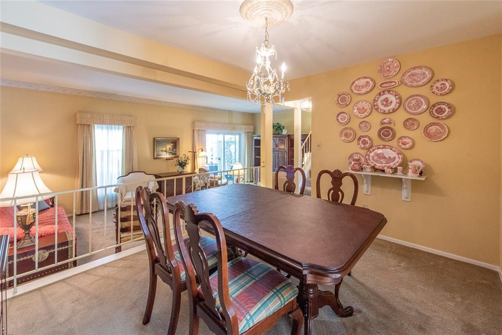 No need to downsize! All your dining room furniture will fit nicely in the spacious dining room. Chandelier being replaced!
