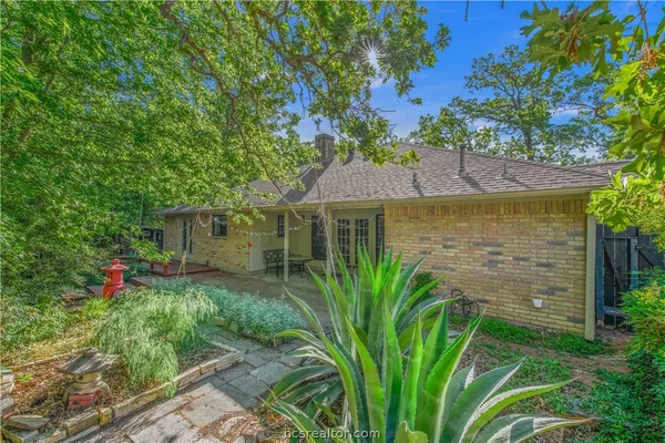 a view of backyard with swimming pool and outdoor seating