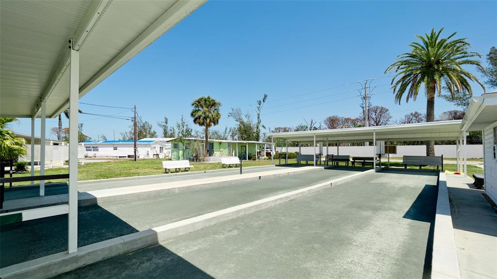 10315 Cortez Road West, Unit 347 Bradenton, FL 34210 - Photo 11 of 27 a view of a swimming pool next to a building