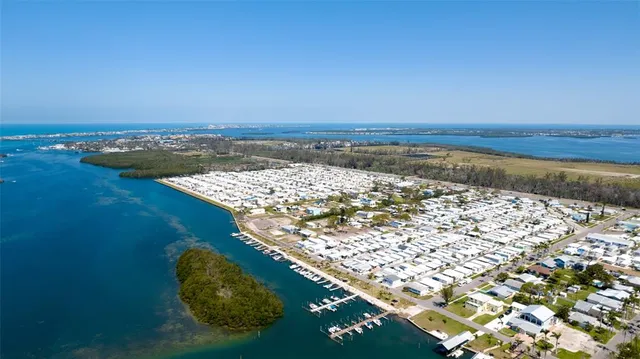 an aerial view of a house with a lake view