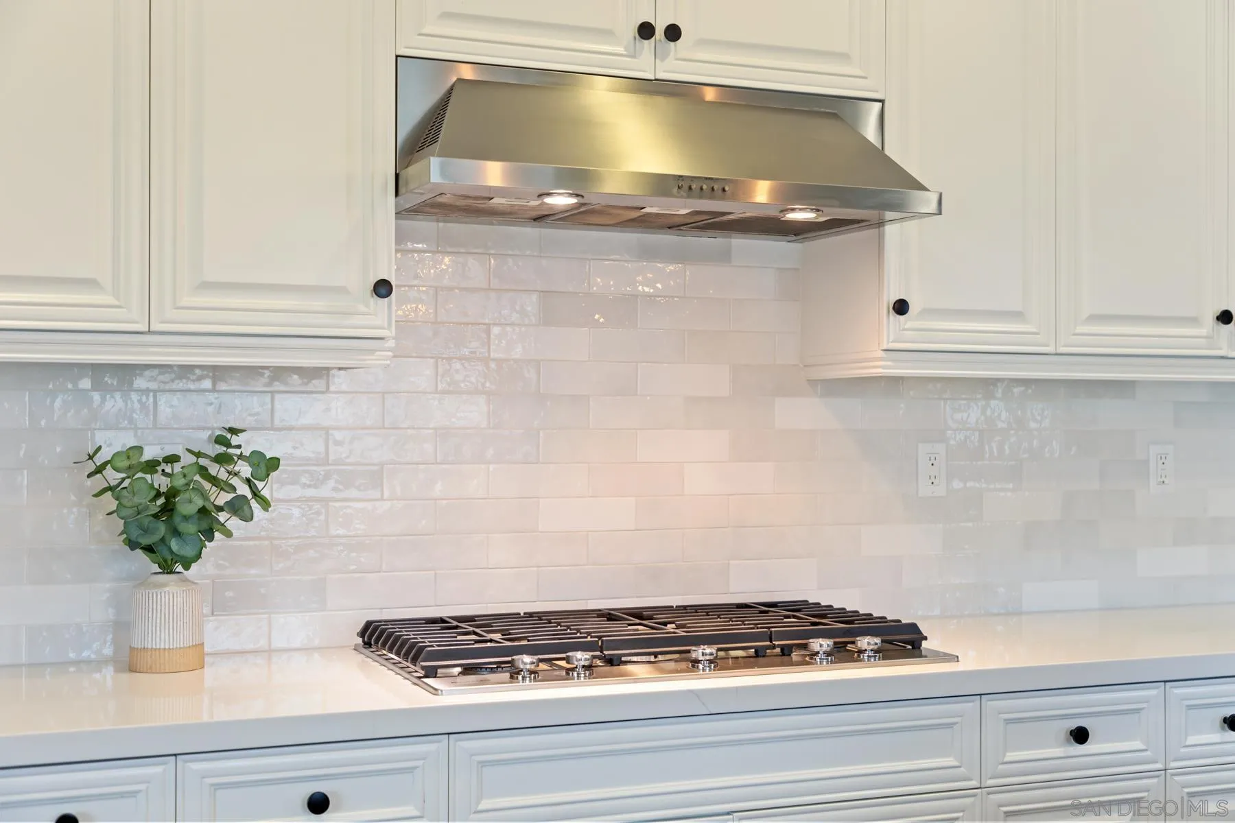 17519 Ralphs Ranch Road San Diego, CA 92127 - Photo 11 of 32 a stove top oven sitting inside of a kitchen