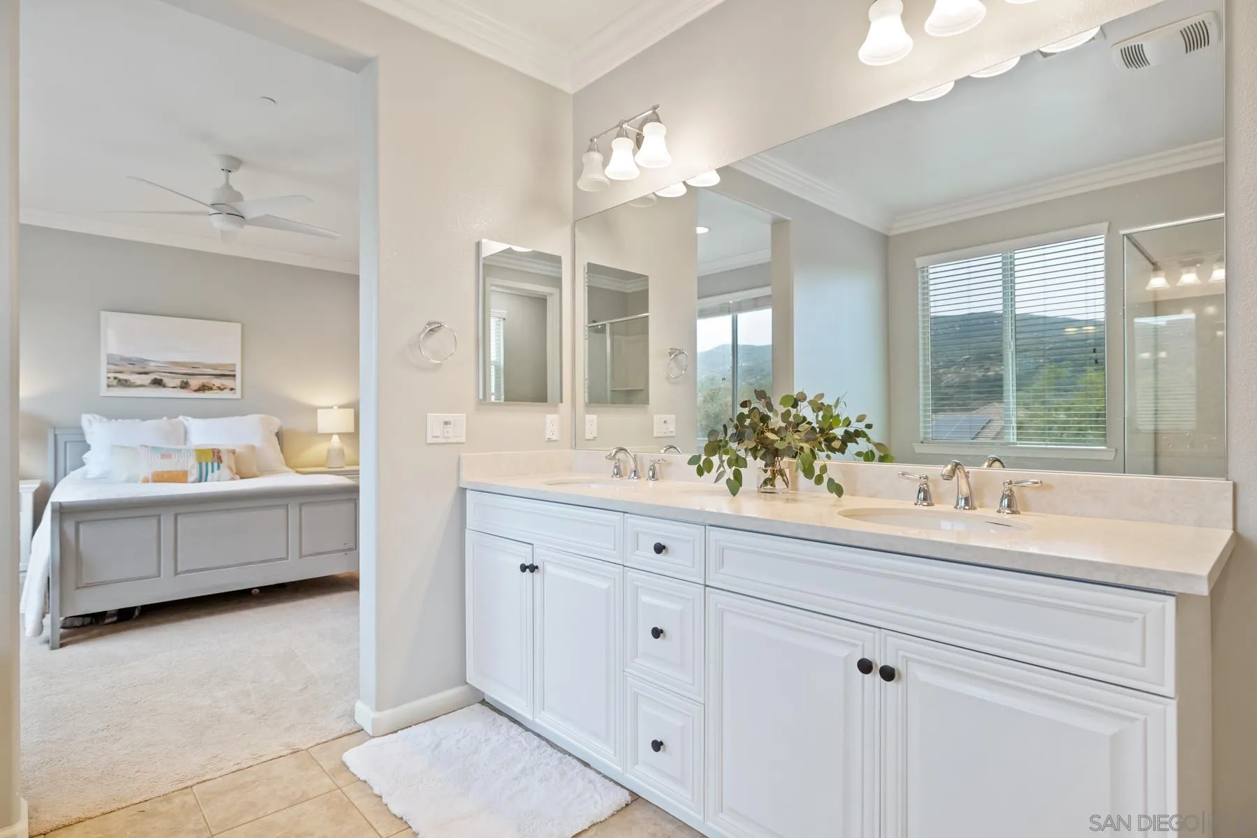 17519 Ralphs Ranch Road San Diego, CA 92127 - Photo 21 of 32 a bathroom with a tub sink and mirror