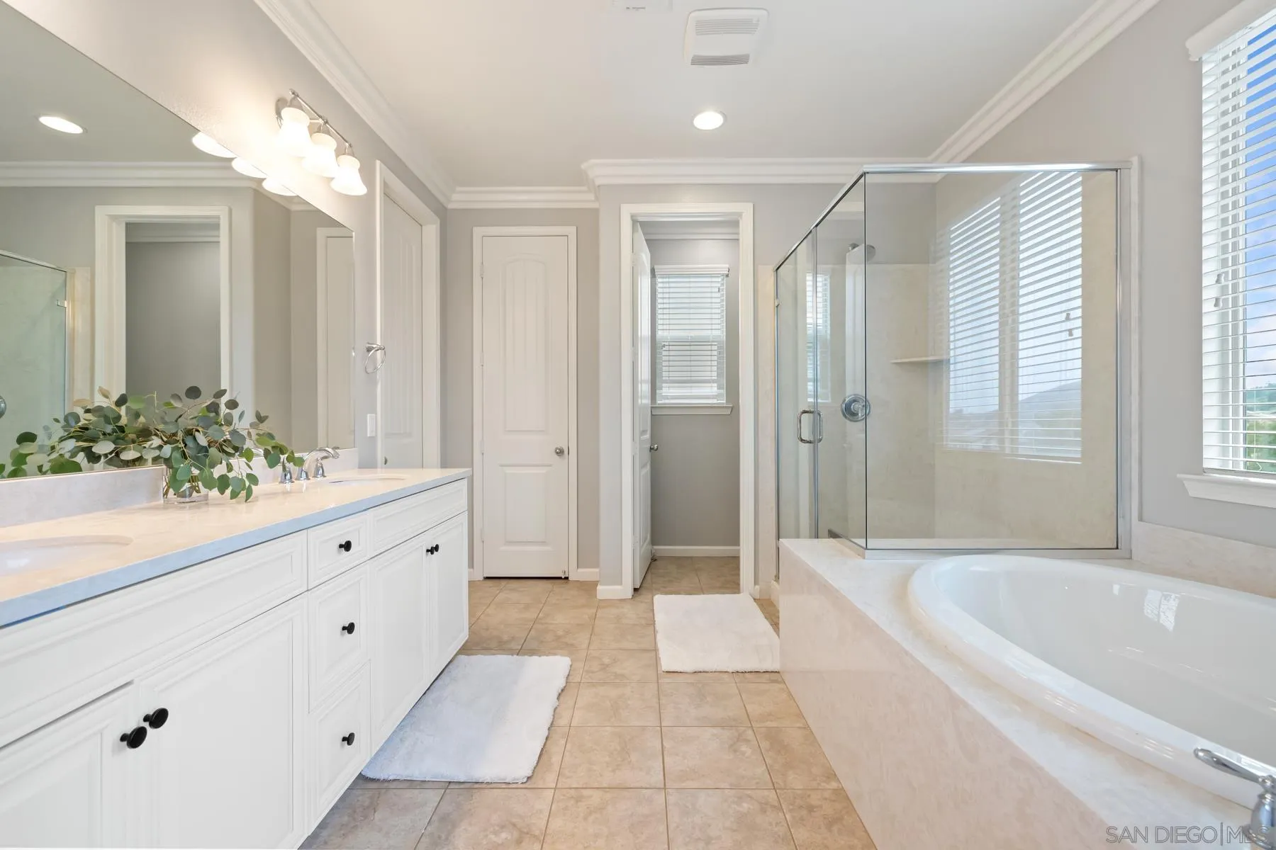 17519 Ralphs Ranch Road San Diego, CA 92127 - Photo 22 of 32 a spacious bathroom with a tub shower and mirror