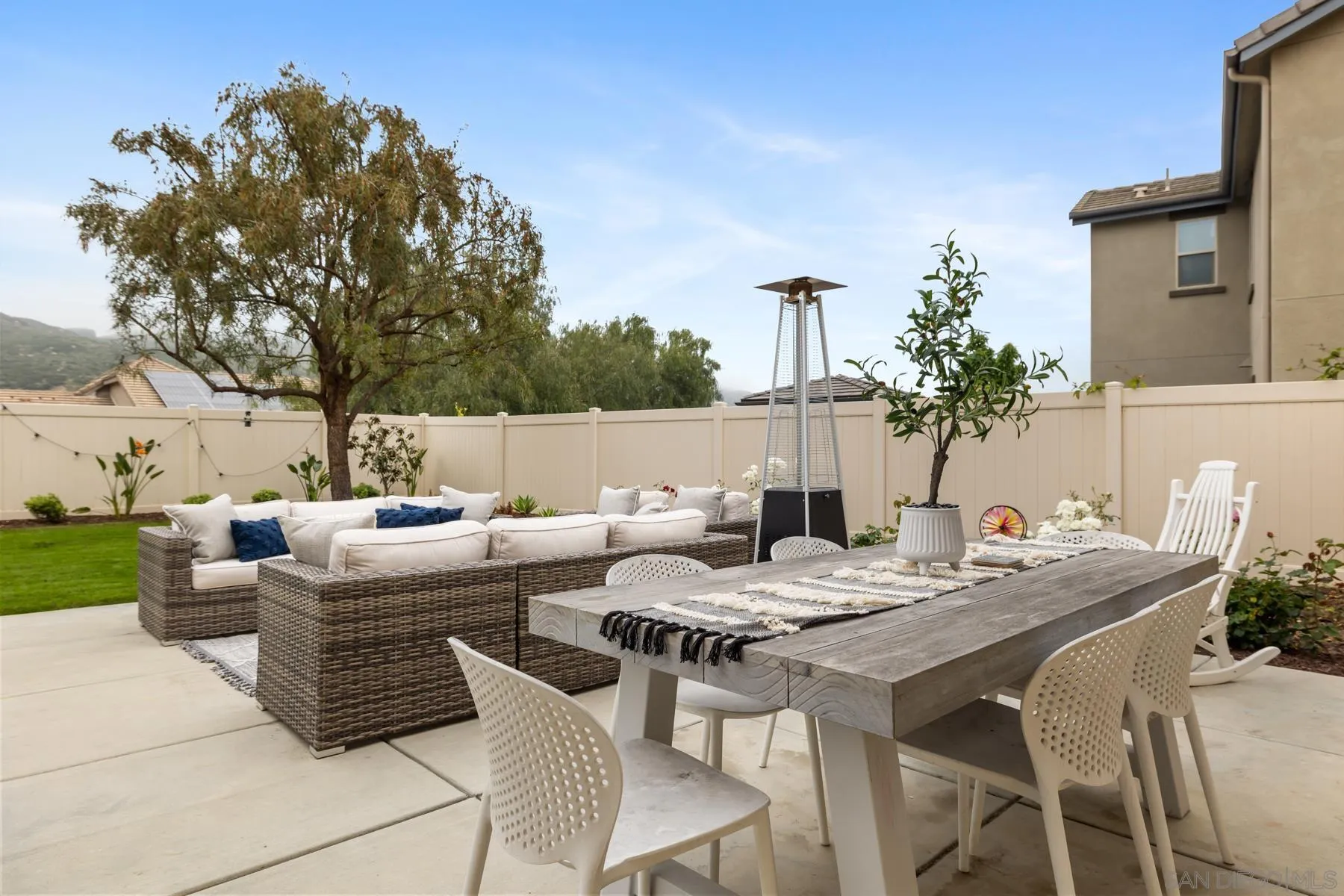 17519 Ralphs Ranch Road San Diego, CA 92127 - Photo 28 of 32 a view of a dinning table and chairs in the patio