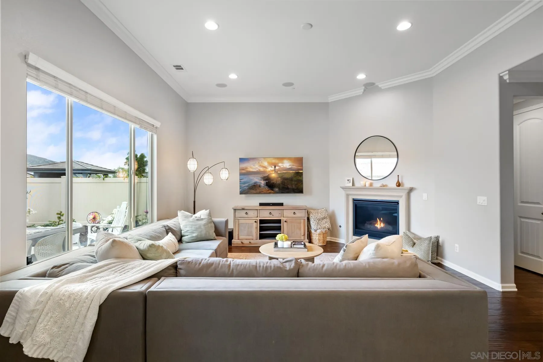 17519 Ralphs Ranch Road San Diego, CA 92127 - Photo 6 of 32 a living room with furniture a fireplace and a flat screen tv