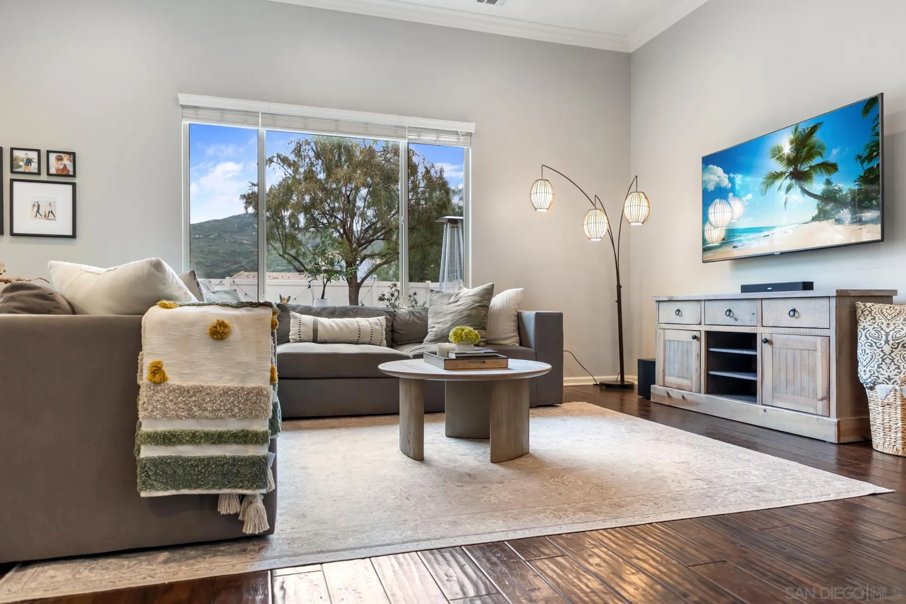 17519 Ralphs Ranch Road San Diego, CA 92127 - Photo 7 of 32 a living room with furniture a flat screen tv and a fireplace
