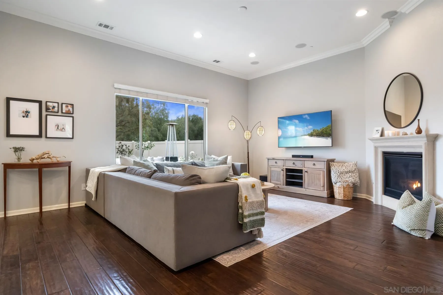 17519 Ralphs Ranch Road San Diego, CA 92127 - Photo 8 of 32 a living room with fireplace furniture and a flat screen tv