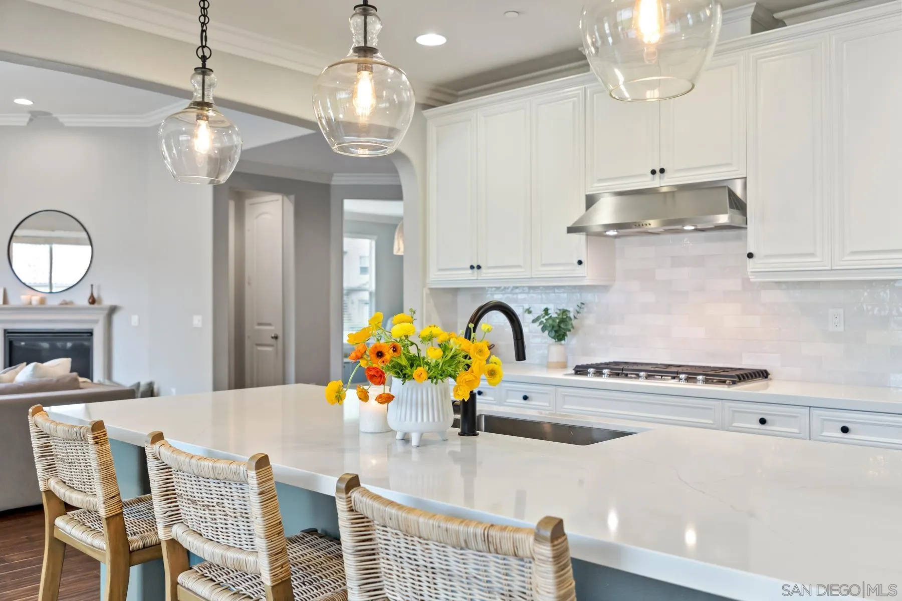 17519 Ralphs Ranch Road San Diego, CA 92127 - Photo 10 of 32 a kitchen with stainless steel appliances kitchen island granite countertop a table and chairs in it