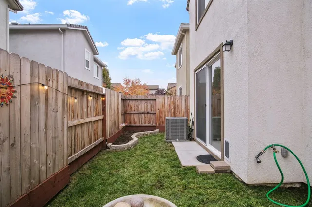 a view of a backyard with sitting area