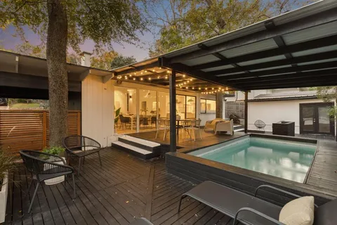 a view of a swimming pool with a patio