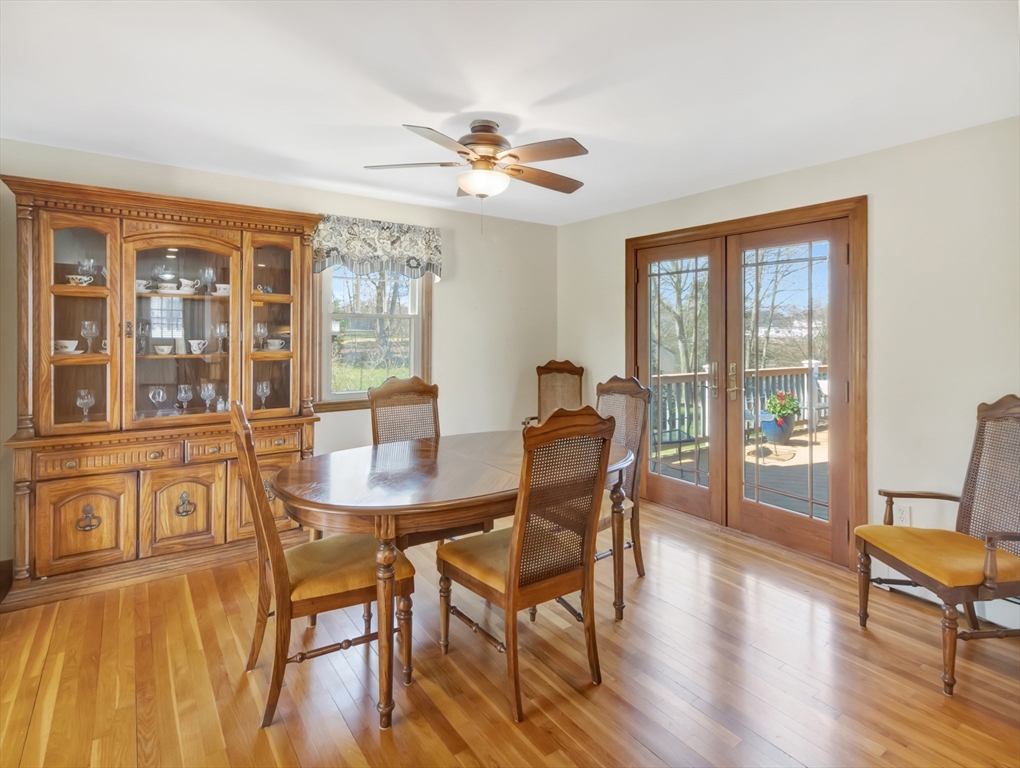 15 Riverside Drive Mansfield, MA 02048 - Photo 7 of 42 a view of a dining room with furniture wooden floor and chandelier